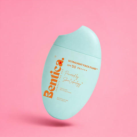 Bentica ultralight face fluid bottle on a pink background