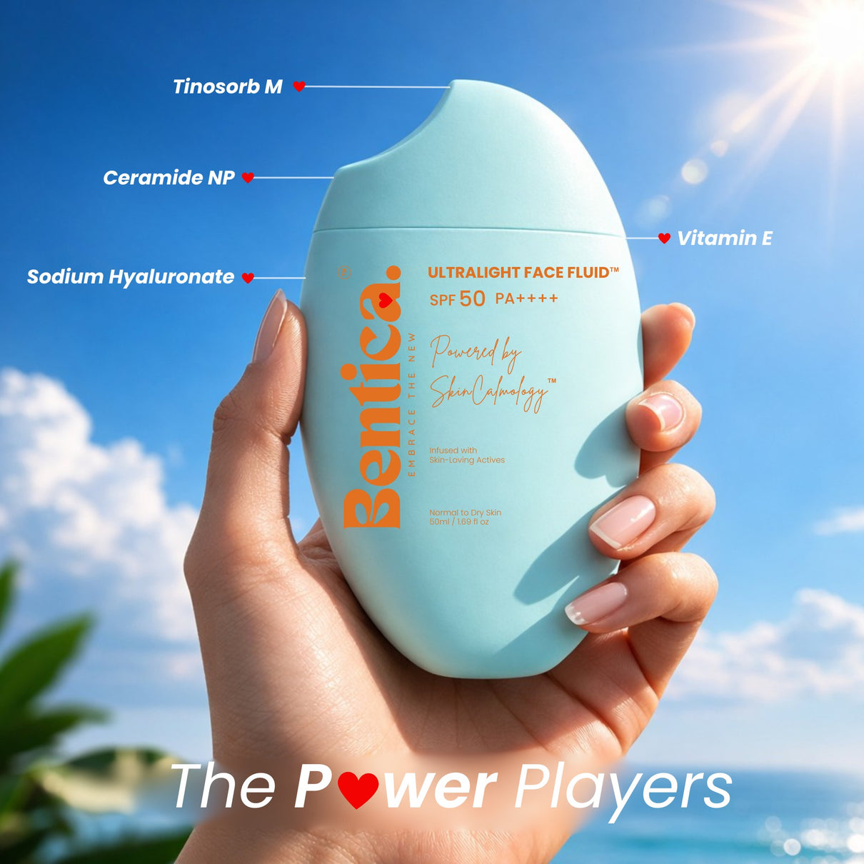 Hand holding a bottle of Benicia UltraLight Face Fluid with a blue sky background