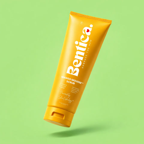 Yellow tube of Bentica Mango Mousse Scrub on a green background