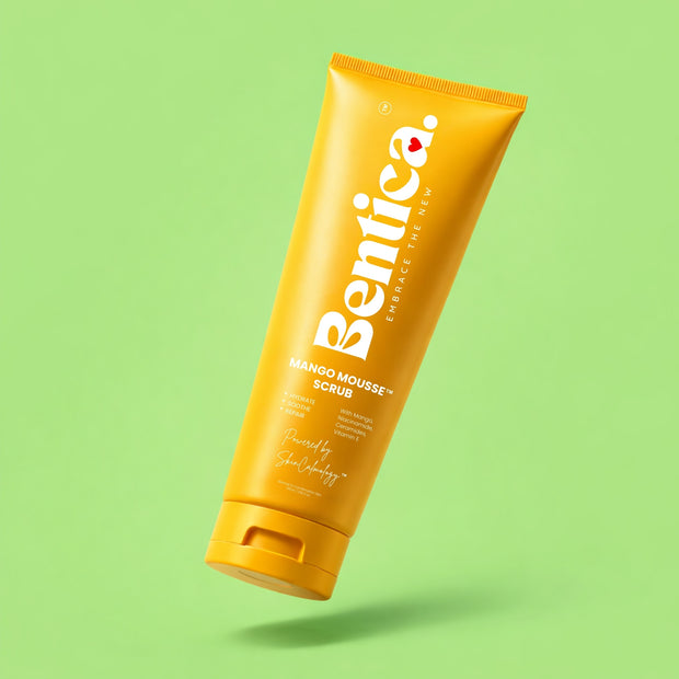 Yellow tube of Bentica Mango Mousse Scrub on a green background